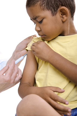 Boy receives a flu vaccine